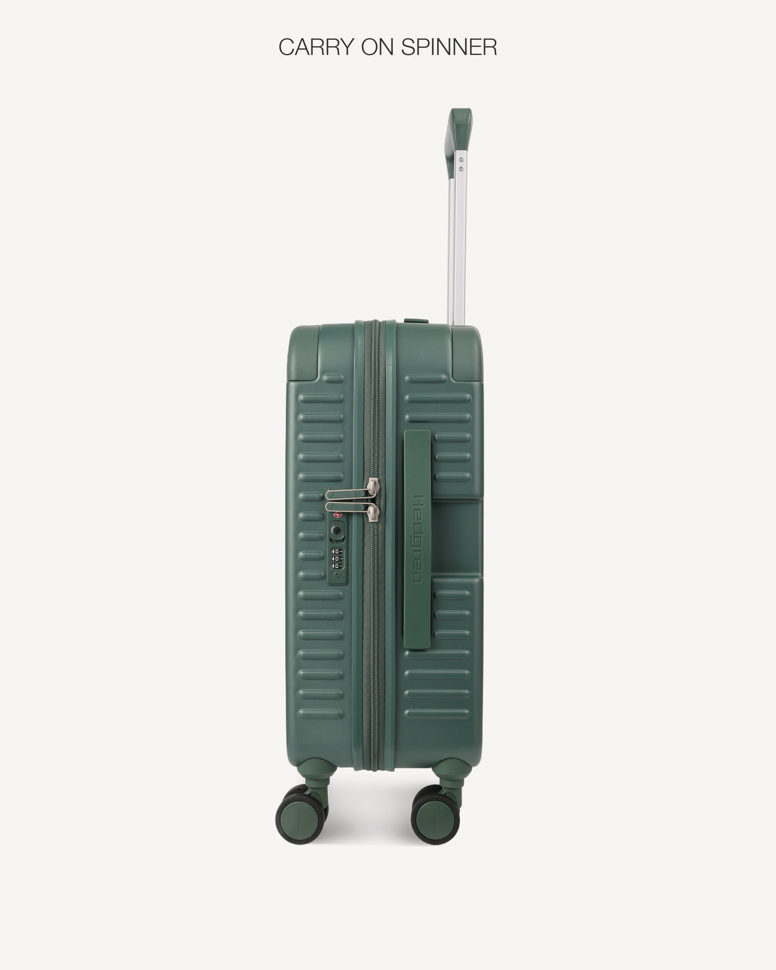 A dark green hard-shell spinner suitcase with a telescoping handle extended, shown from the front against a light gray background. The text 'CARRY ON SPINNER' is printed at the top.