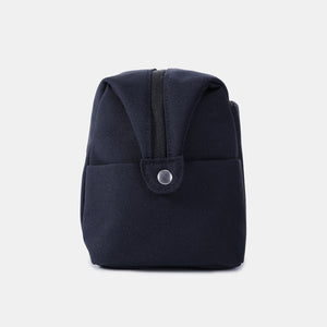 Side view of Hedgren Break Toiletry Bag in peacoat blue