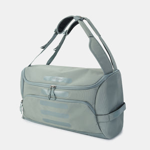 Front angled view of Hedgren's Sojourn Duffle Backpack in grey green