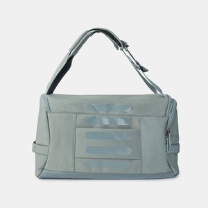 Back of Hedgren's Sojourn Duffle Backpack in grey green