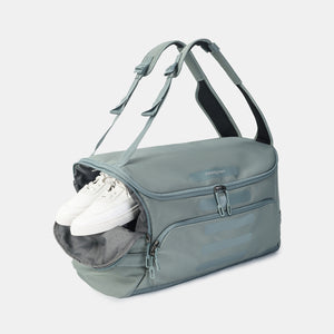 Shoe pocket on Hedgren's Sojourn Duffle Backpack in grey green