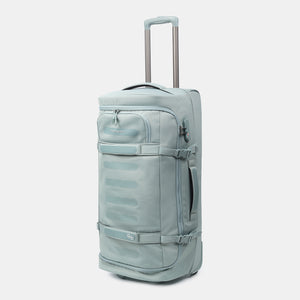 Front angled view of Hedgren's COMPACT rolling duffle in grey green