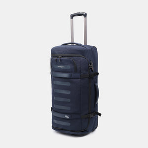 Front angled view of Hedgren's COMPACT rolling duffle in peacoat blue