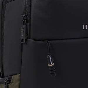 Close up of zipper on Hedgren's TRAM Laptop Backpack in Urban Jungle