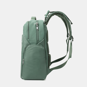 Side view of Hedgren's TSUTSUMI Diaper Backpack in Duck Green