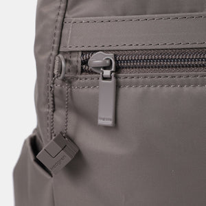 Close up of zipper on Vogue XXL 14" laptop backpack in sepia (taupe)