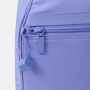 Close up of zipper on the Vogue small backpack in Jacaranda Blue