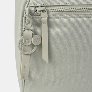 Close up of zipper on the Vogue small backpack in Willow Grey 