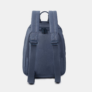 Back side view of the Vogue small backpack in Vintage Indigo