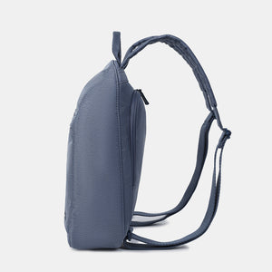 Side view of the Vogue small backpack in Vintage Indigo