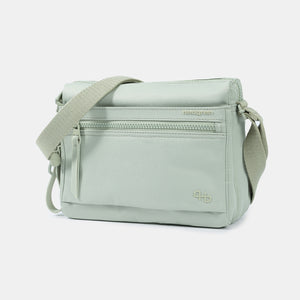 Front angled view of the Eye RFID shoulder bag in willow grey