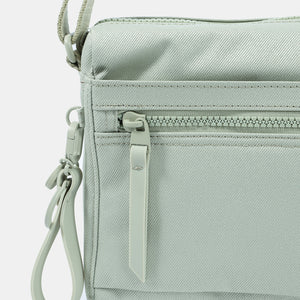 Close up of zipper on the Eye RFID shoulder bag in willow grey