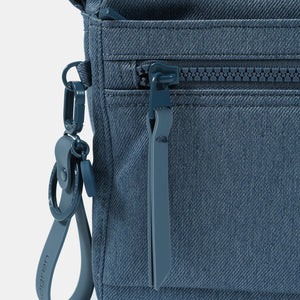 Close up of zipper on the Eye RFID shoulder bag in vintage indigo