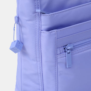 Close up of the zipper on the Orva RFID Crossbody in Jacaranda Blue