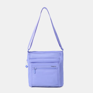 Orva RFID Crossbody in Jacaranda Blue with strap extended