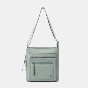 Orva RFID Crossbody in lily pad with strap extended