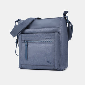 Front angled view of Orva RFID Crossbody in vintage indigo 