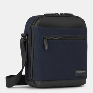 Front angled view of Hedgren's APP crossbody in Elegant Blue