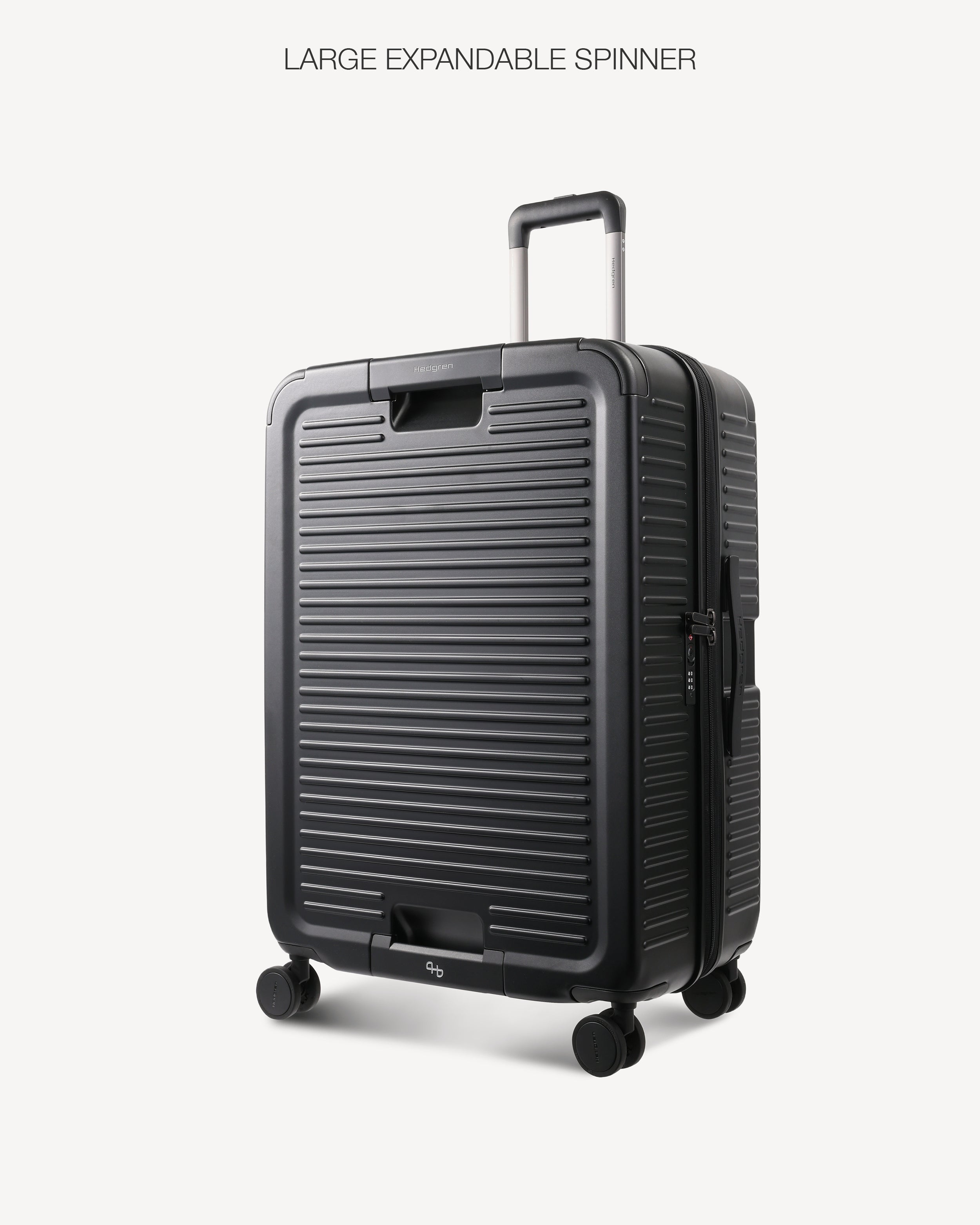 A large hard-shell spinner suitcase in dark gray with a ribbed front design, shown on a light gray background with the text 'LARGE EXPANDABLE SPINNER' above it.