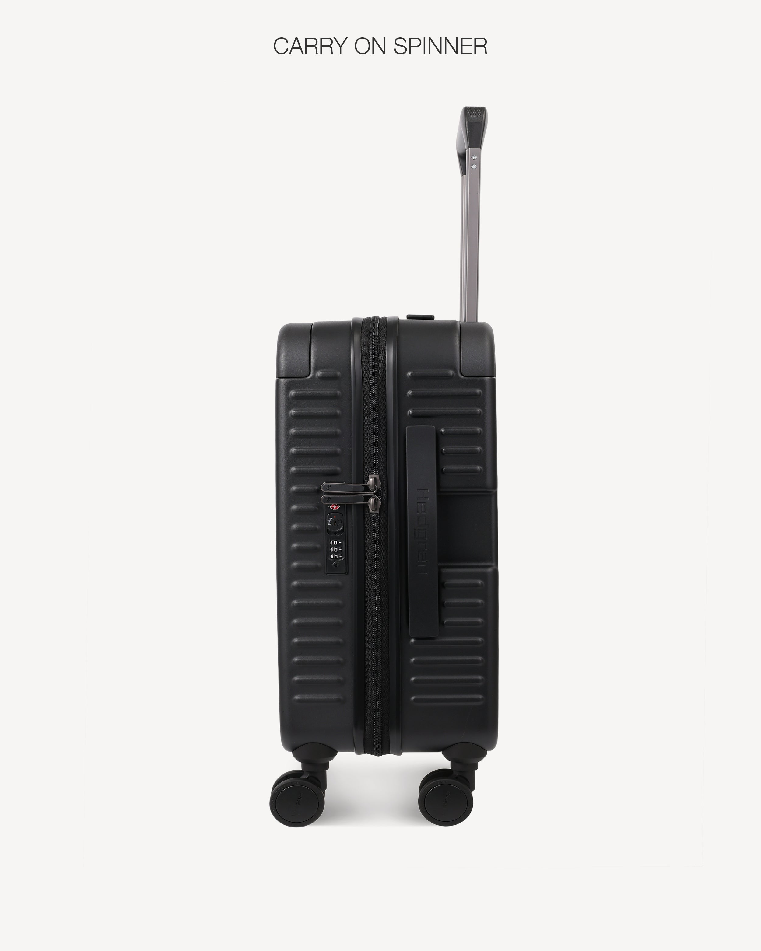 Black suitcase with wheels and a handle on a white background