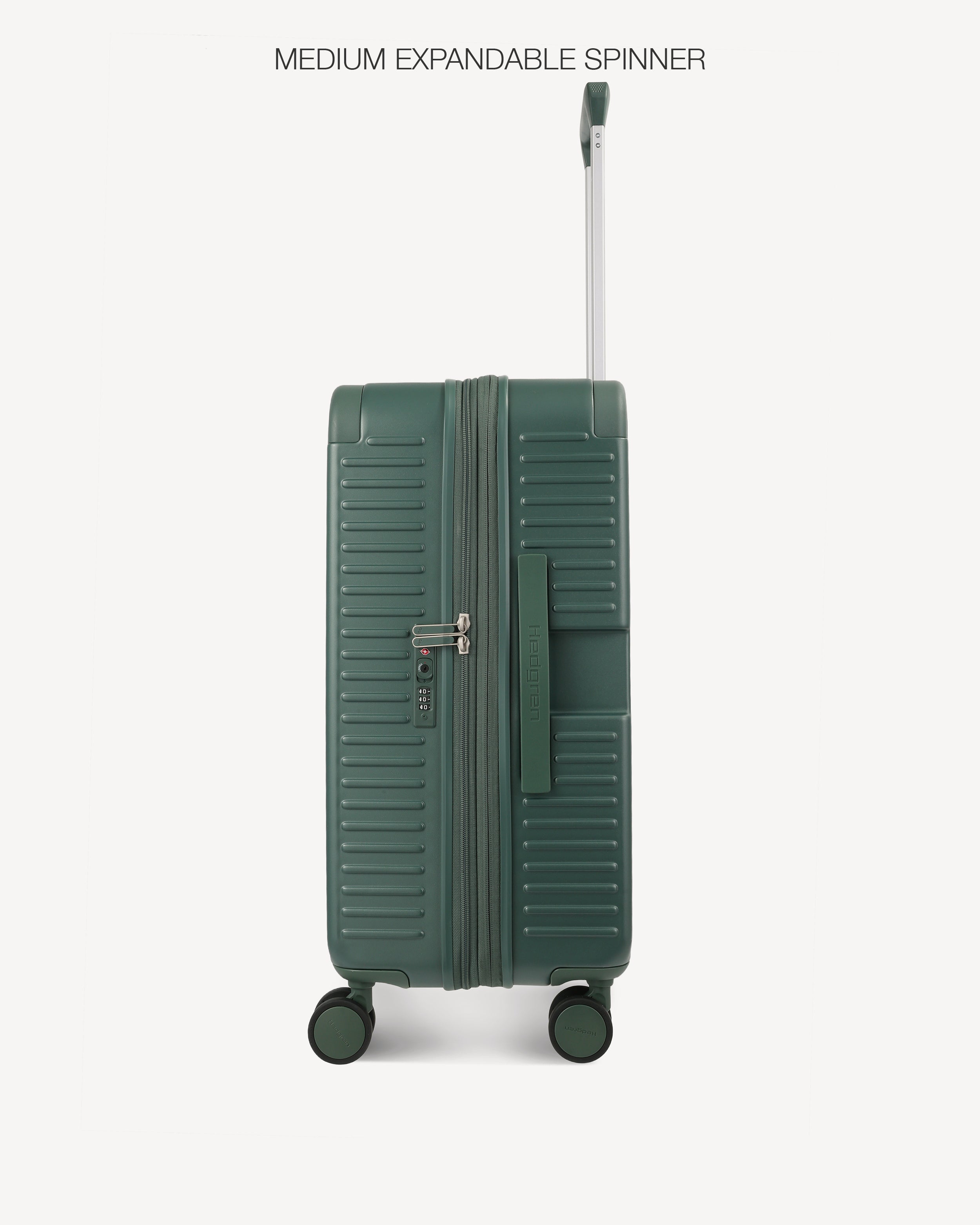 A dark green hardshell spinner suitcase with a telescoping handle extended, shown from the front against a light gray background. The text 'MEDIUM EXPANDABLE SPINNER' is printed at the top.
