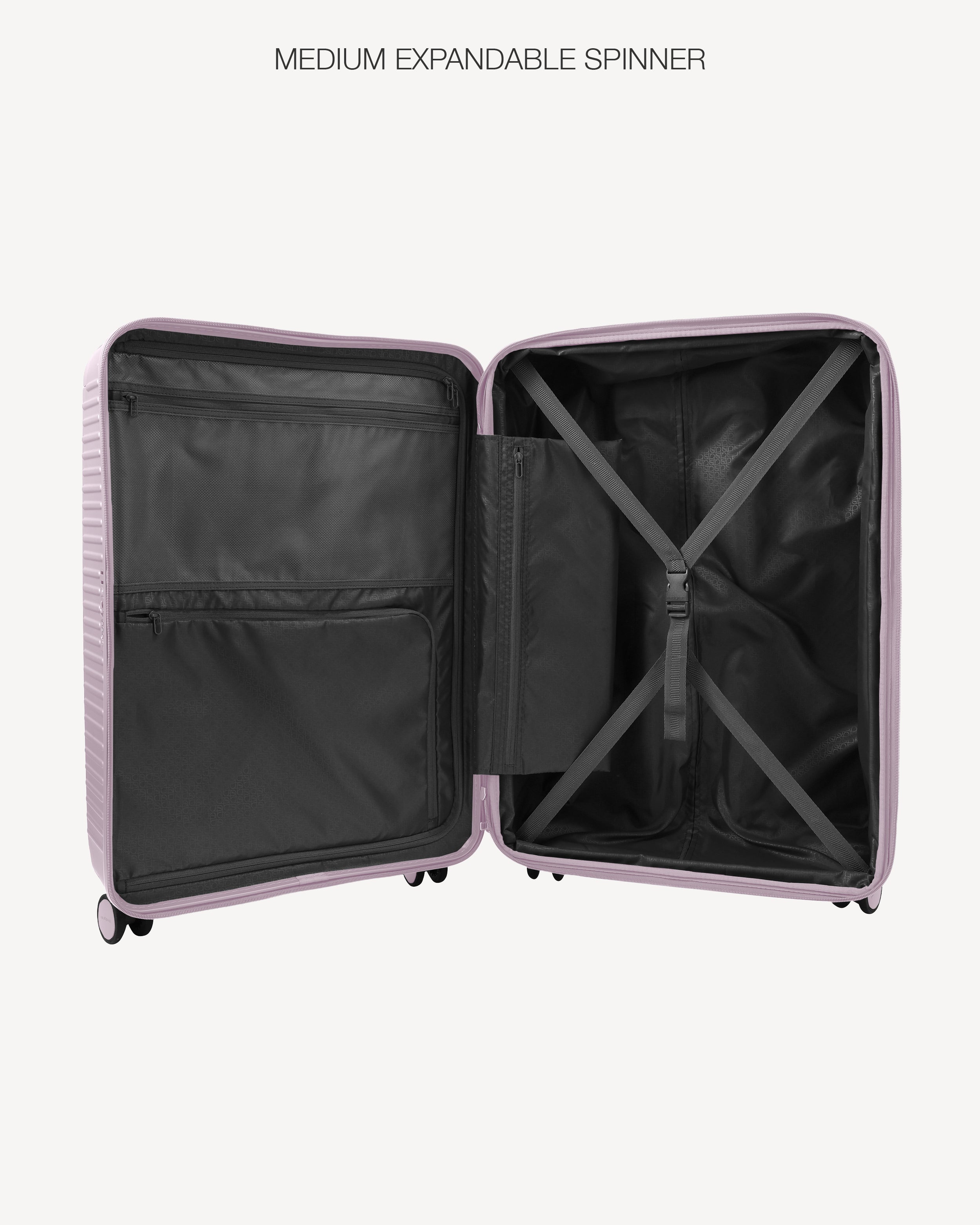 An open hard-shell suitcase shown from above on a light gray background, with the text 'LARGE EXPANDABLE SPINNER' above it. The exterior shell is a warm beige/tan color, and the interior lining is black with a compression strap system.