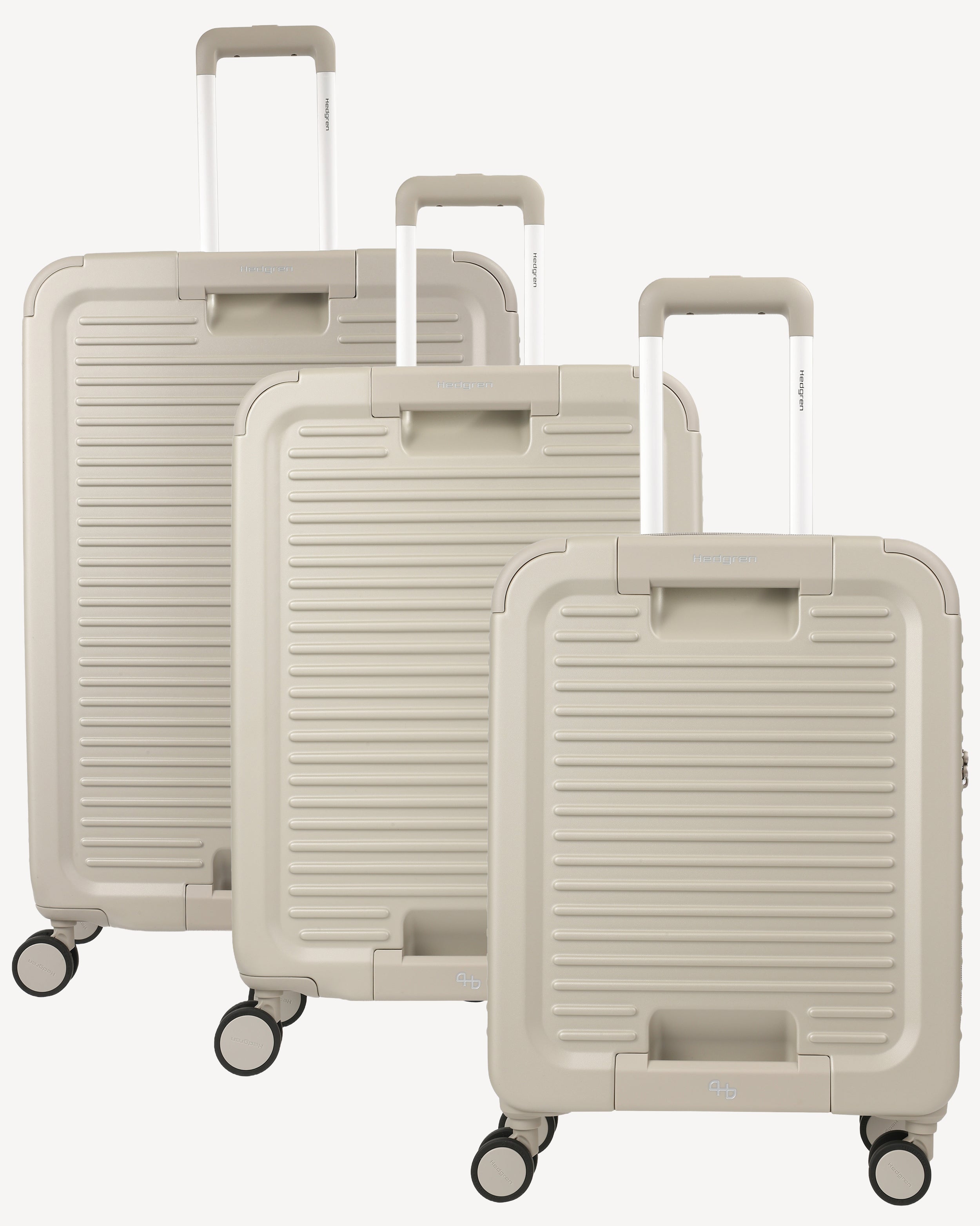 Three hard-shell spinner suitcases in a matching light grey color, arranged in a size progression from largest to smallest on a clean white background.