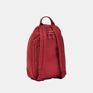 Back side of the Vogue small backpack in sun dried tomato red. Main access to bag is on the back panel. 