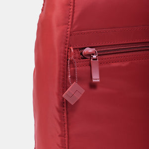 Close up of zipper on Vogue Small Backpack in Sun Dried Tomato Red