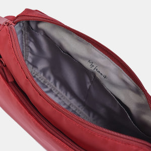 Interior of the Eye RFID shoulder bag in sun dried tomato red